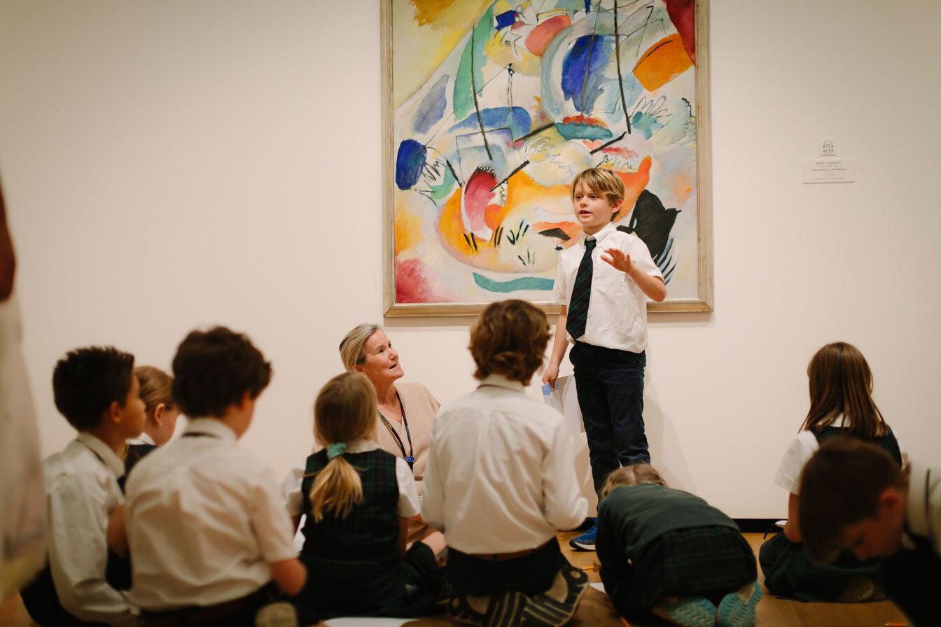 students in front of a painting at the NGA